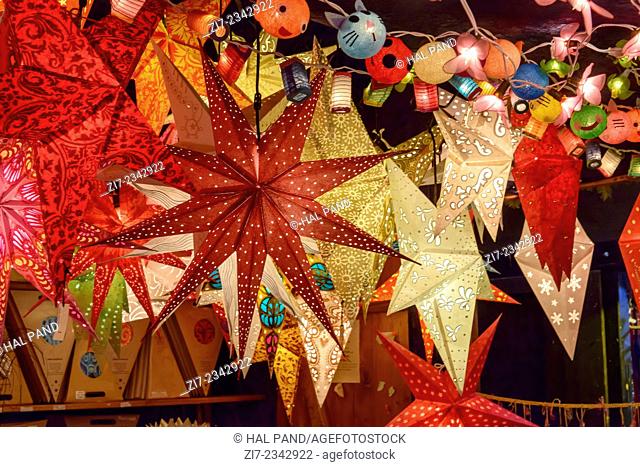 detail of lightened stars in stall at traditional Christmas market hold in city center, Stuttgart, Germany