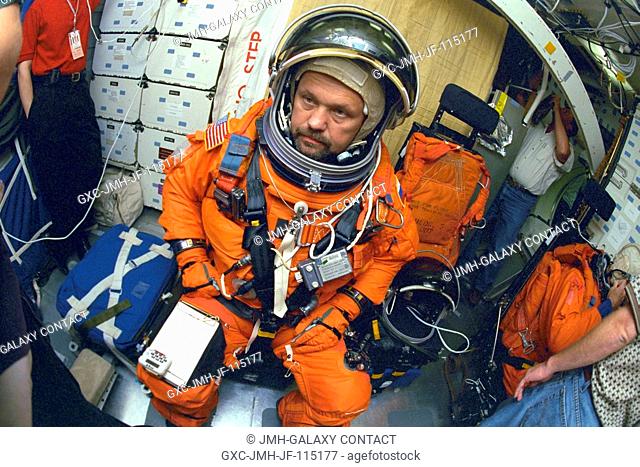 Cosmonaut Boris V. Morukov, mission specialist representing the Russian Aviation and Space Agency, participates in a launch and entry procedures simulation on...