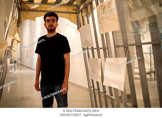 Divali Haskan from Iraq pictured in the collaborative artwork Zelt (tent) at the exhibition ""daHeim: Einsichten in das flüchtige Leben"" (lit