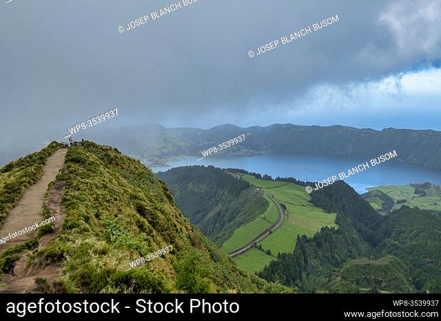 Mountain landscape with hiking trail and view of beautiful lakes, Ponta Delgada, Sao Miguel Island, Azores, Portugal