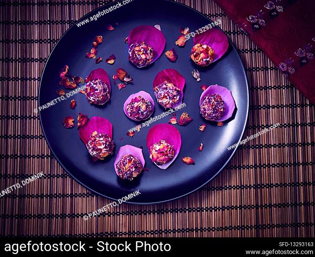 Laddu (Indian dessert) with rose petals