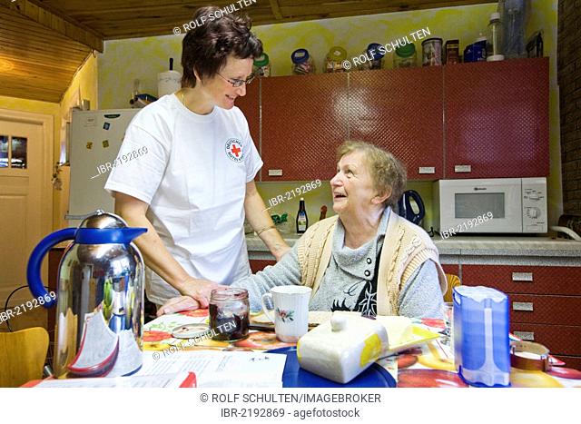 Ambulatory care of the German Red Cross, nurse Anke Lehmann preparing breakfast for a heart attack patient, Treuenbrietzen, Brandenburg, Germany, Europe