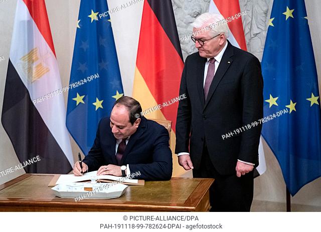 18 November 2019, Berlin: Abdel Fattah al-Sisi, President of Egypt, signs the guest book at Bellevue Castle on the occasion of his visit to Federal President...