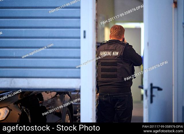 17 November 2020, North Rhine-Westphalia, Cologne: An investigator is standing in a building on the grounds of the property at 145 Oskar Jäger Strasse during a...