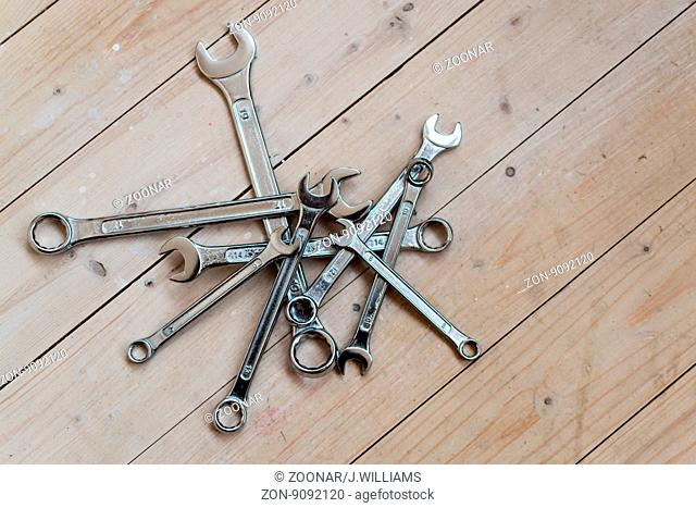 DIY Set of chrome metal home spanners. The wrenches are of various sizes with large copy space area for construction or repair concepts with nobody present