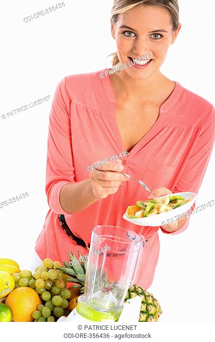 Woman smoothie preparation
