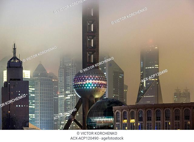 Oriental Pearl TV tower and Pudong skyline in the mist, Shanghai