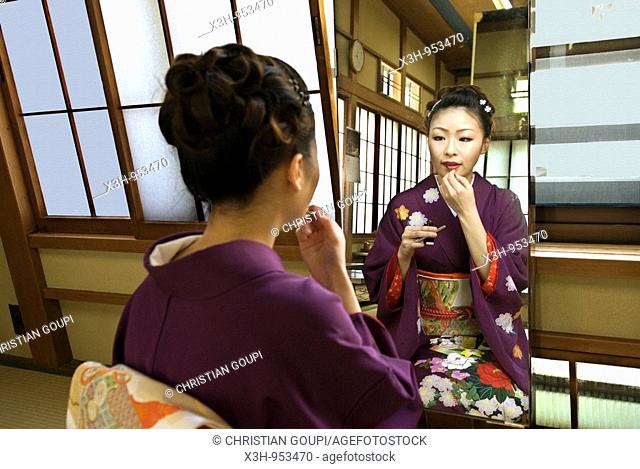 young women kimono dressed making up, women association in Hakone for teaching traditional art to behave for 'maiko' geisha apprentice, Hakone, Japan