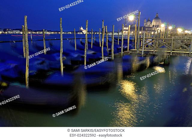 Santa Maria della Salute and gondolas at night, Venice, Italy (long exposure)