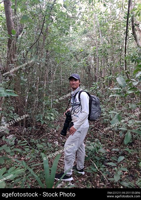 07 December 2023, Mexico, Playa del Carmen: German Elias Siebenborn in the jungle near a route that was deforested for the Mayan train