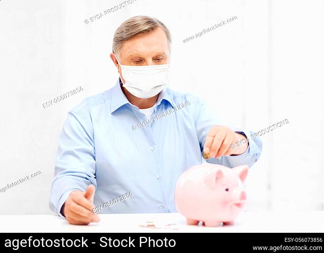 old man in mask putting coin into big piggy bank