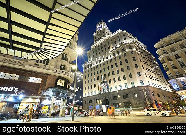 Telefonica Building at Gran Via street seen from Red de San Luis square. Madrid, Spain. Known as one of the most famous buldings in the city