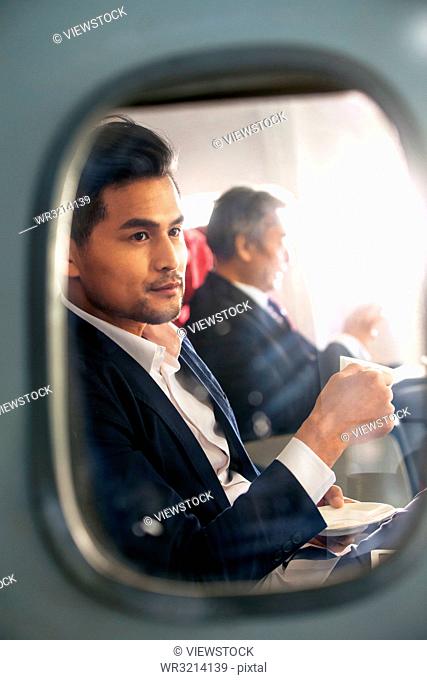 Business people by plane