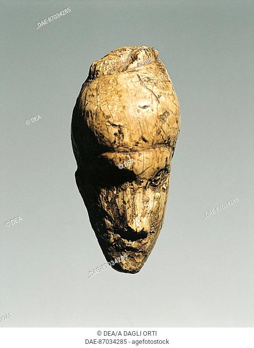 Prehistory, Czech Republic, Paleolithic, Gravettian - Bone pendant depicting human face from Dolni Vestonice.  Brno, Etnograficke Muzeum Moravskeho Muzea V Brne...