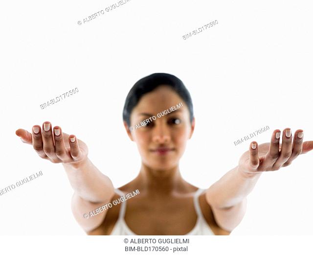 Close up of woman meditating with arms outstretched