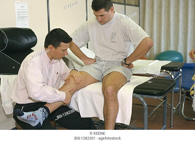 MAN IN REHABILITATION<BR>Photo essay. Patient and health professional.<BR>France's National Institute of Physical Education. Physical therapist