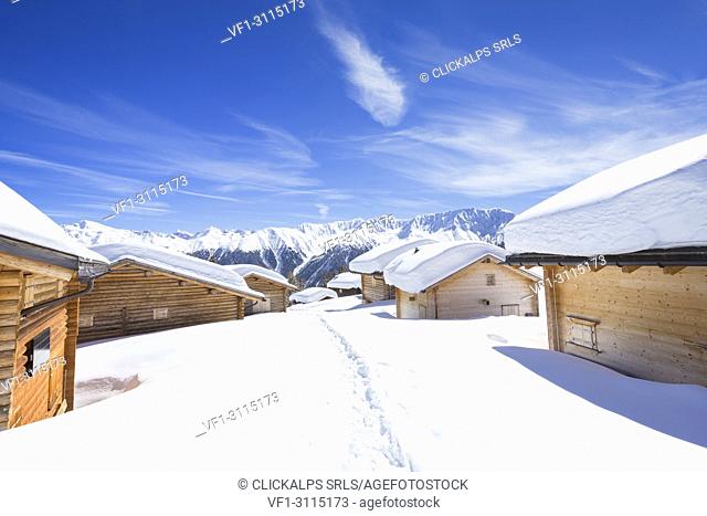 Typical alpine huts after a heavy snowfall. Wiesner Alp, Davos Wiesen, Landwasser Valley, Albula Valley, District of Prattigau/Davos, Canton of Graubünden