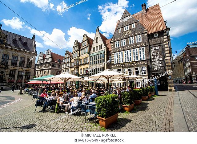 Beer garden in front of old Hanse houses on the market square of Bremen, Germany, Europe