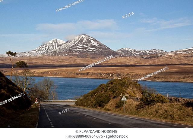 The snow covered Paps of Jura viewed over the Sound of Islay on the road to Port Askaig