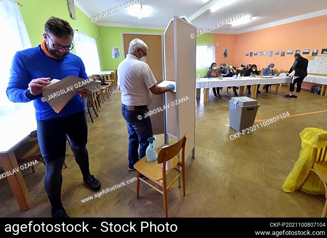People (tourists, cyclist) vote during elections to the Chamber of Deputies of the Parliament of the Czech Republic, on October 8, 2021, in Ublo, Czech Republic