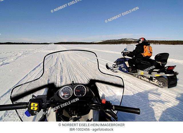 Snowmobile tour on Lake Inari, Inari, Lapland, Finland, Europe