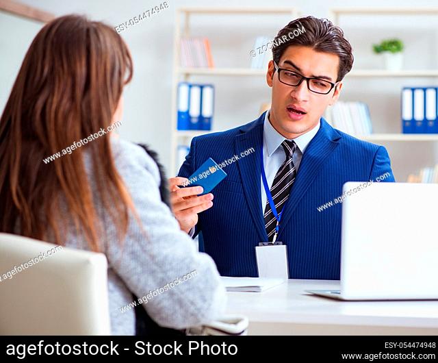 The woman makes payment with credit card