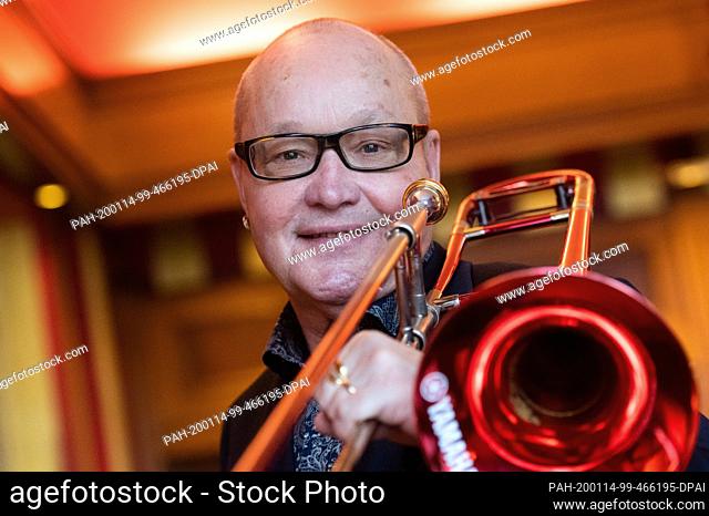 14 January 2020, Berlin: Nils Landgren, Swedish musician, is standing with his trombone in a hotel. Landgren will tour Germany from the end of March 2020
