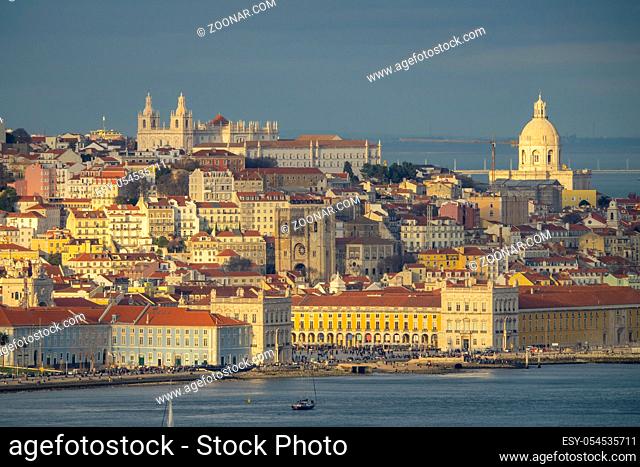 Aerial view of Lisbon old city center at sunset, view from Almada, Portugal