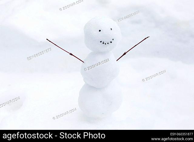 funny snowman snow bank