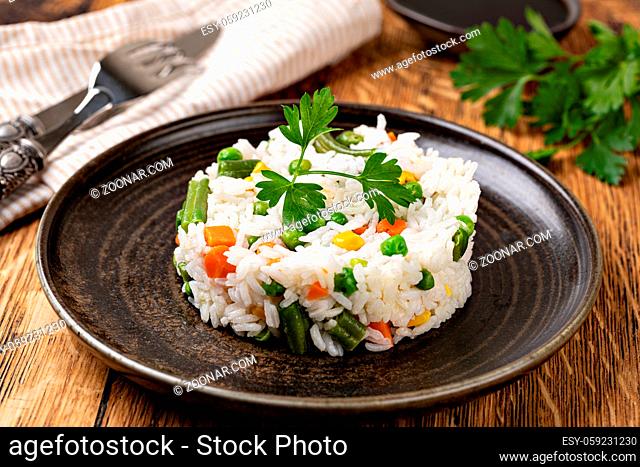 Bowl with tasty rice and vegetables. Selective focus