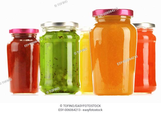Jars of fruity jams isolated on white background. Preserved fruits