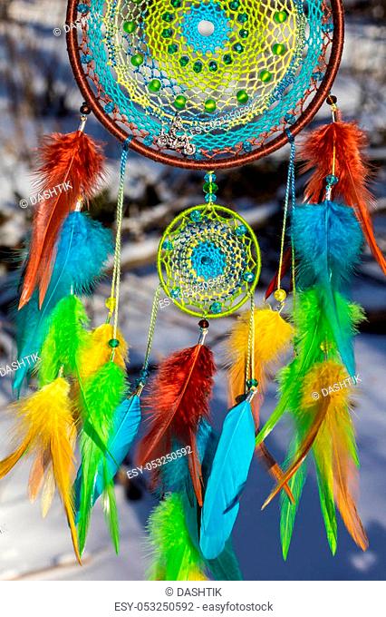 Colorful Dreamcatcher made of feathers leather beads and ropes, hanging, handmade
