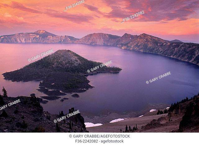 Alpenglow on storm clouds at sunset over Crater Lake, Crater Lake National Park, Oregon
