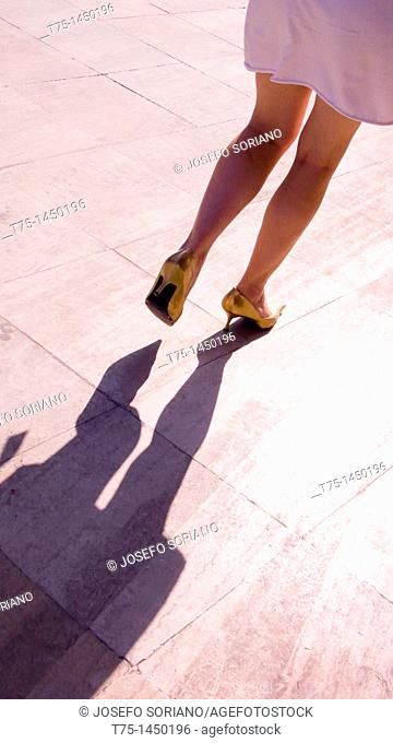 Woman with golden shoes