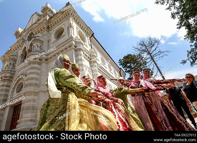 RUSSIA, SIMFEROPOL - MAY 20, 2023: Women wearing traditional costumes attend the opening of Simferopol's Karaite kenesa after restoration