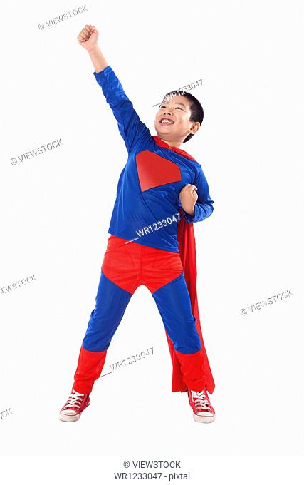 A boy in superman outfit