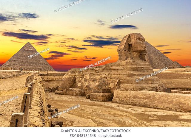 The Sphinx and the Pyramids at sunset, beautiful view, Giza, Egypt