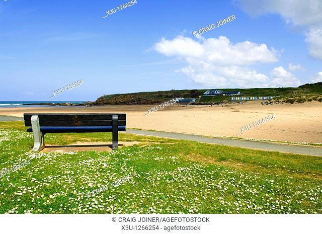 A seat overlooking Summerleaze Beach on a sunny spring day  Bude, North Cornwall, England, United Kingdom
