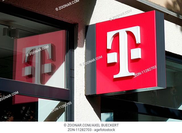 Hannover, Germany - October 8, 2017: T logo at German telecommunications company Telekom Deutschland chain store at Lister Meile