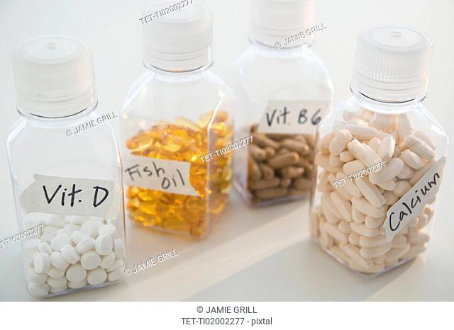 Studio shot of various pills in bottles