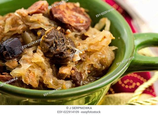 traditional polish sauerkraut (bigos) with mushrooms and plums