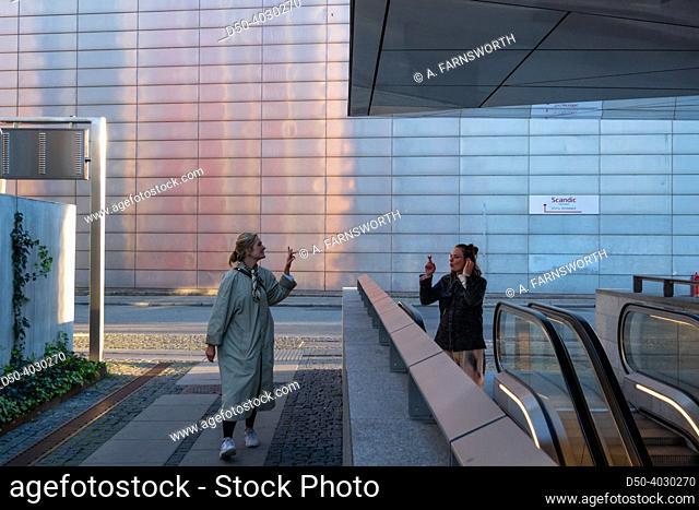 Copenhagen, Denmark Two women say goodbye at the Metro at the Frederiksberg Centret