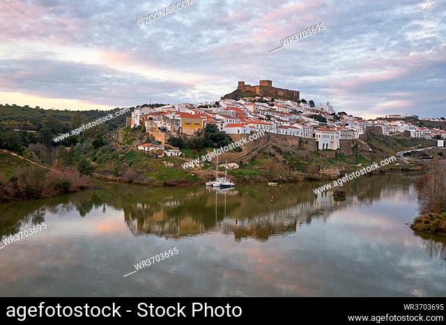 Mertola city view at sunset with Guadiana river in Alentejo, Portugal