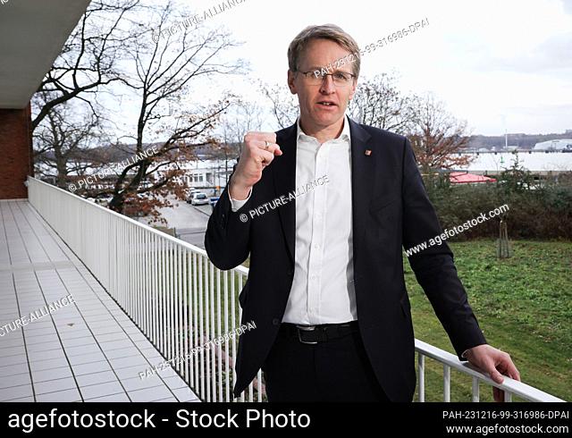 PRODUCTION - 14 December 2023, Schleswig-Holstein, Kiel: Daniel Günther (CDU), Minister President of Schleswig-Holstein, stands on the balcony of his office in...