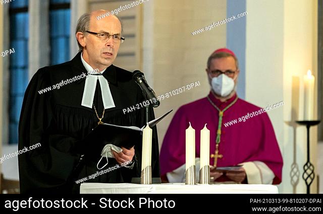 13 March 2021, Schleswig-Holstein, Kiel: Stefan Heße (r), Catholic Archbishop of Hamburg, listens to Gothart Magaard, Bishop of the Schleswig and Holstein...