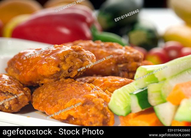 buffalo chicken wings served with pinzimonio