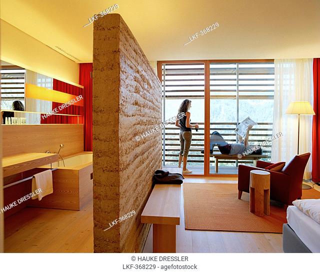 Couple on a balcony of a hotel room, Vigilius Mountain Resort, Vigiljoch, Lana, Trentino-Alto Adige/Suedtirol, Italy