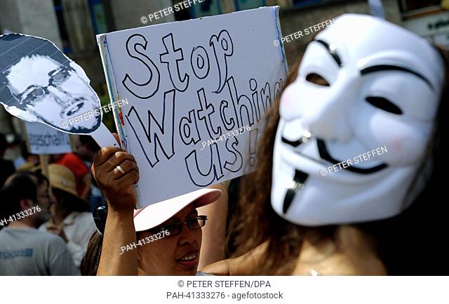 Hundreds of demonstrators protest against the spying by the US National Security Agency in Hanover, Germany, 27 July 2013