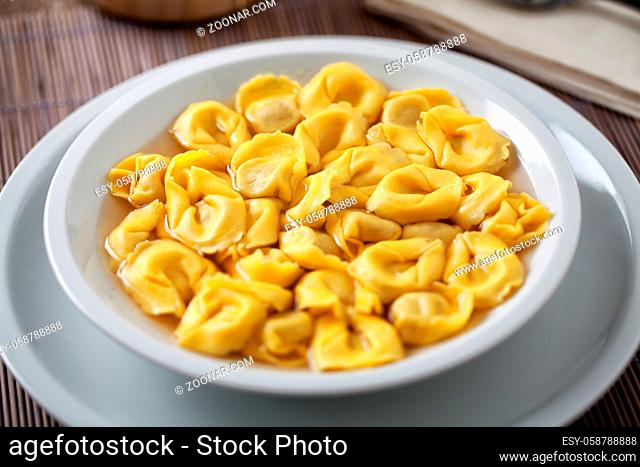 Italian Tortellini In broth on a plate