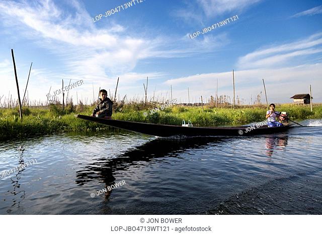 Myanmar, Shan, Lake Inle. Everyday transport on the back-waters of Lake Inle in Myanmar